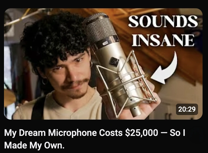 Roan holding his custom-built U47-inspired tube microphone